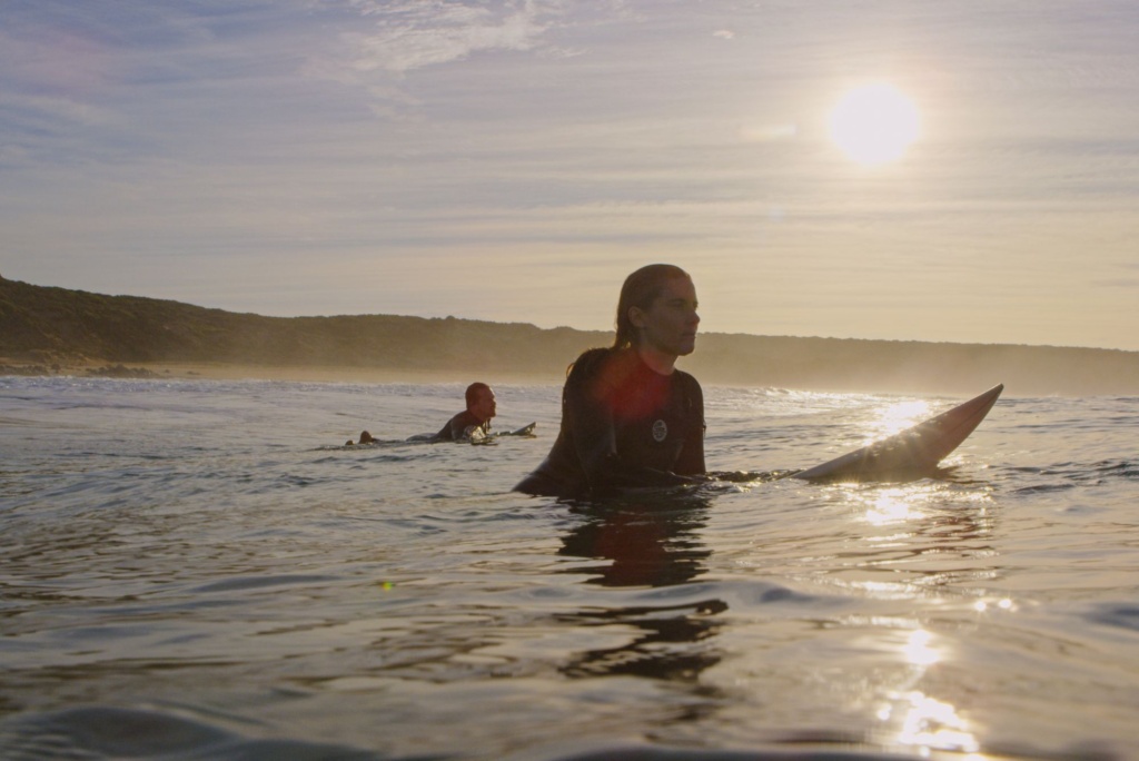 Two people surfing in Waitpinga